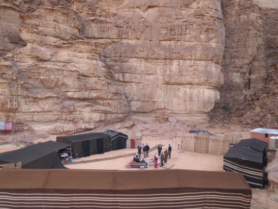 The Bedouin camp, sheltered in the rocky nook